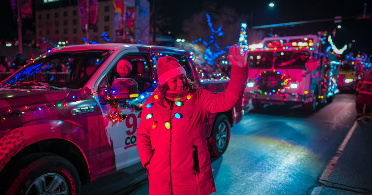 A woman walks next to a float at the Santa Claus Parade in 2023.