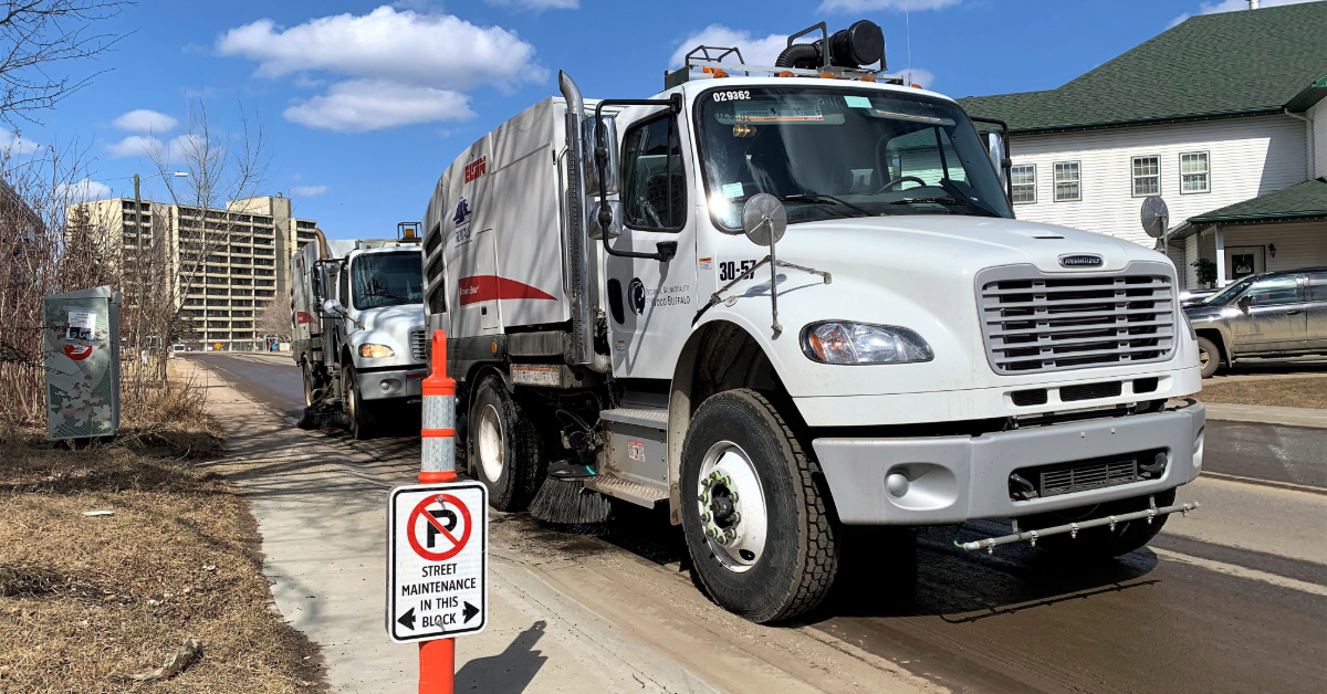 Street sweeping crews working