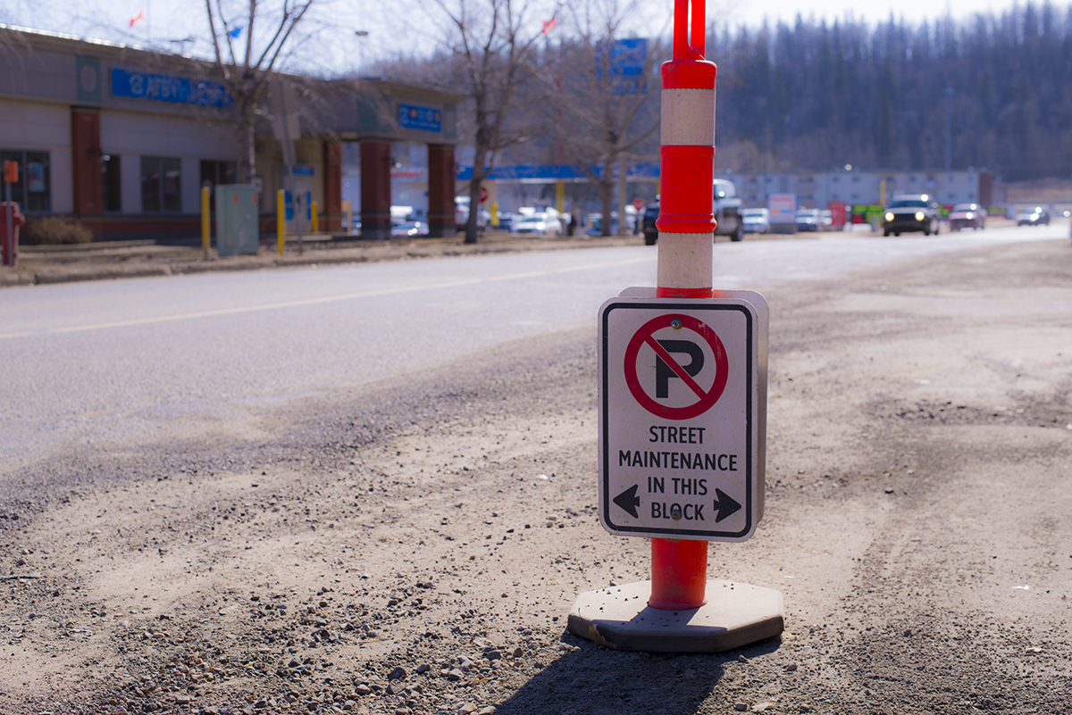 Street maintenance sign on the side of the road