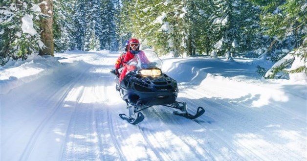 Snowmobile on trail