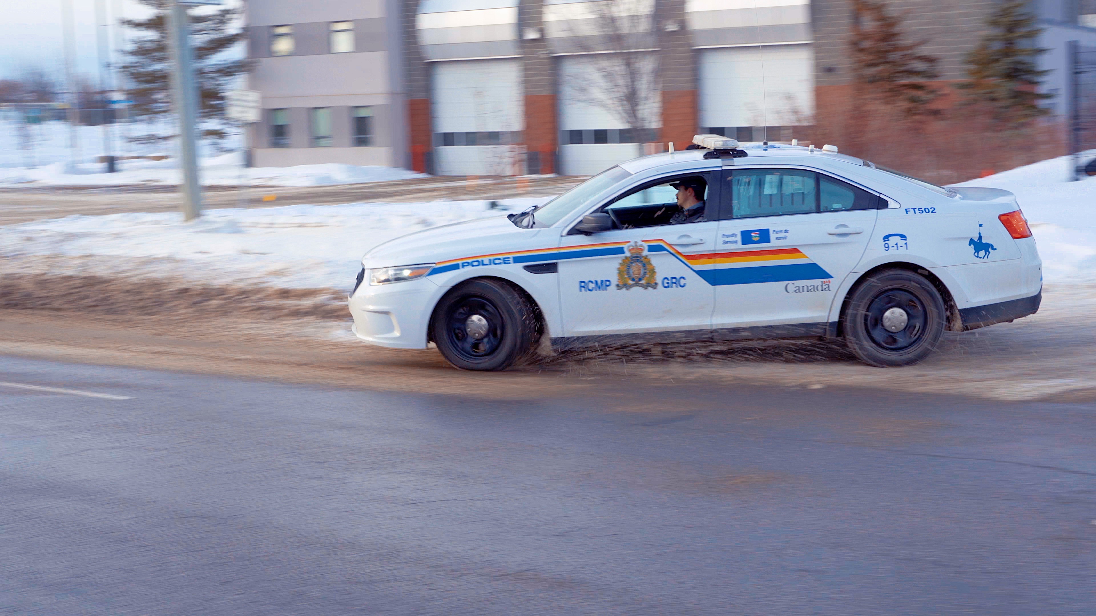 RCMP car pulls onto street in Fort McMurray, Alta. in 2025.