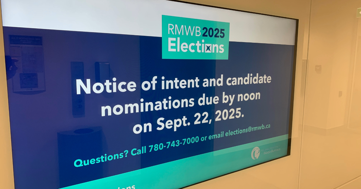 Photo of digital display sign stating nominations are open for 2025 election candidates, in Jubilee Building in Fort McMurray, Alta.