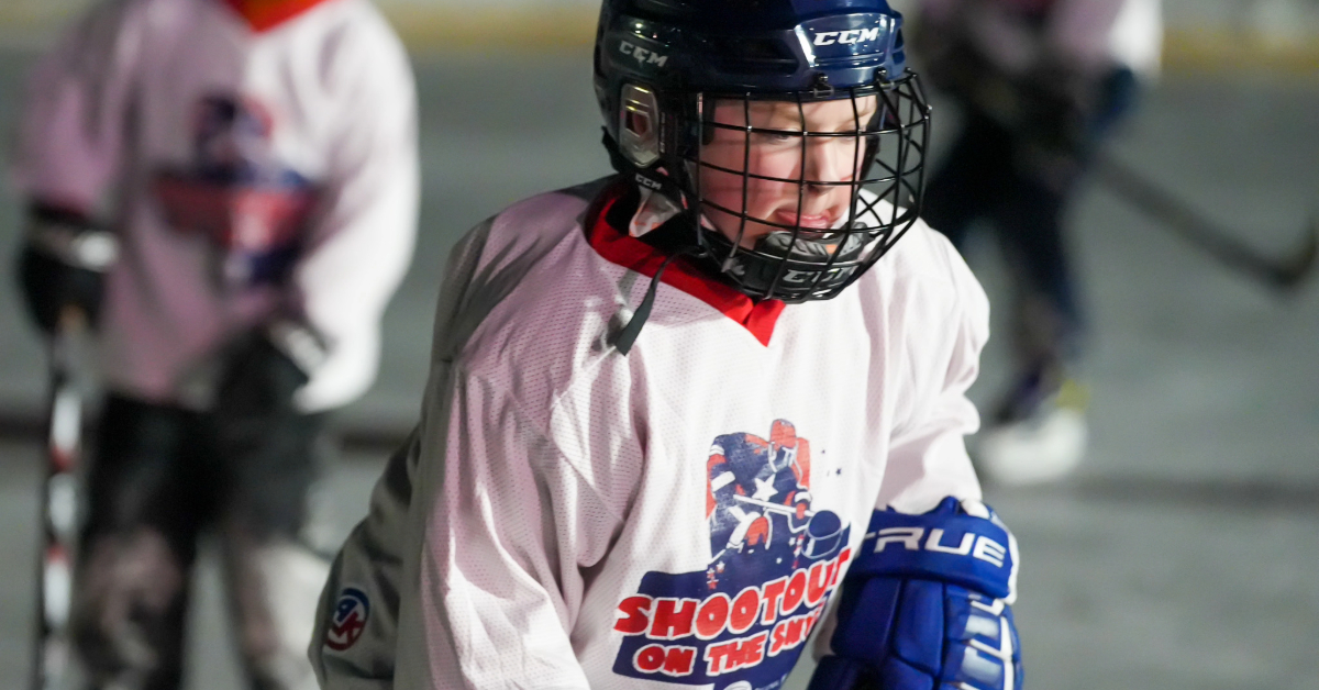 A hockey player skates at Snye Point during Shootout on the Snye 2023
