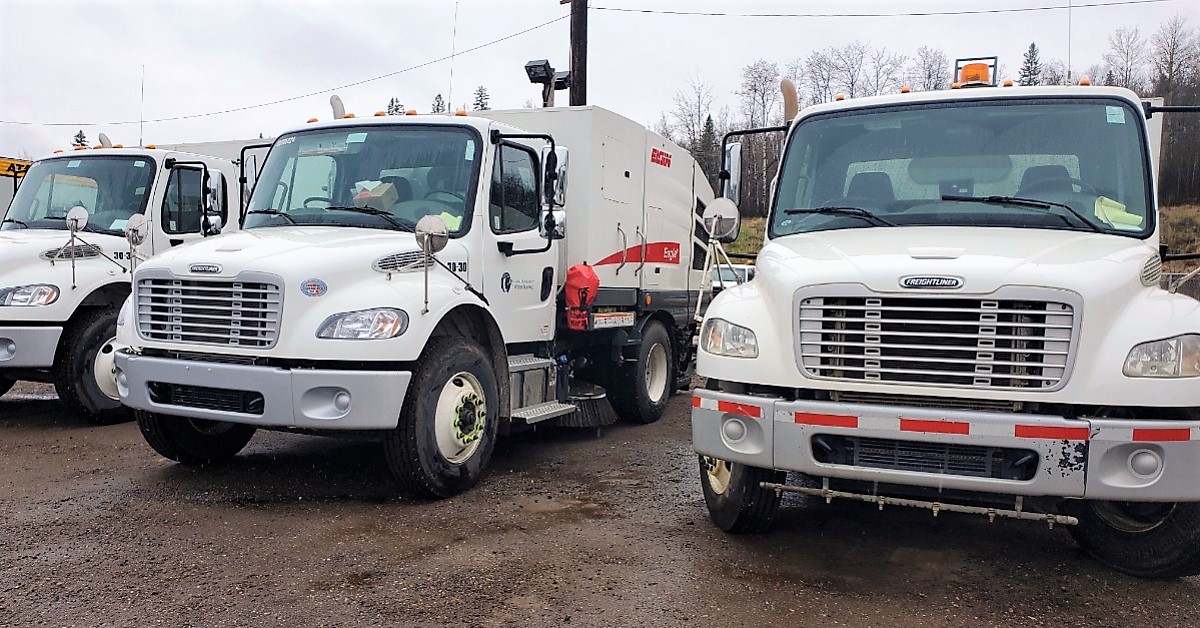 Municipal street sweeper trucks rest in the yard in Fort McMurray, Alta.