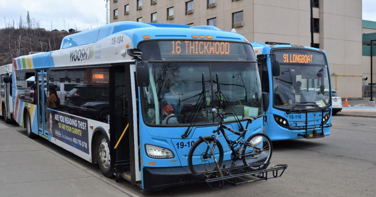 Buses line up for passengers to embark at the Main Street Terminal in Fort McMuray, Alta. on April 26, 2023.