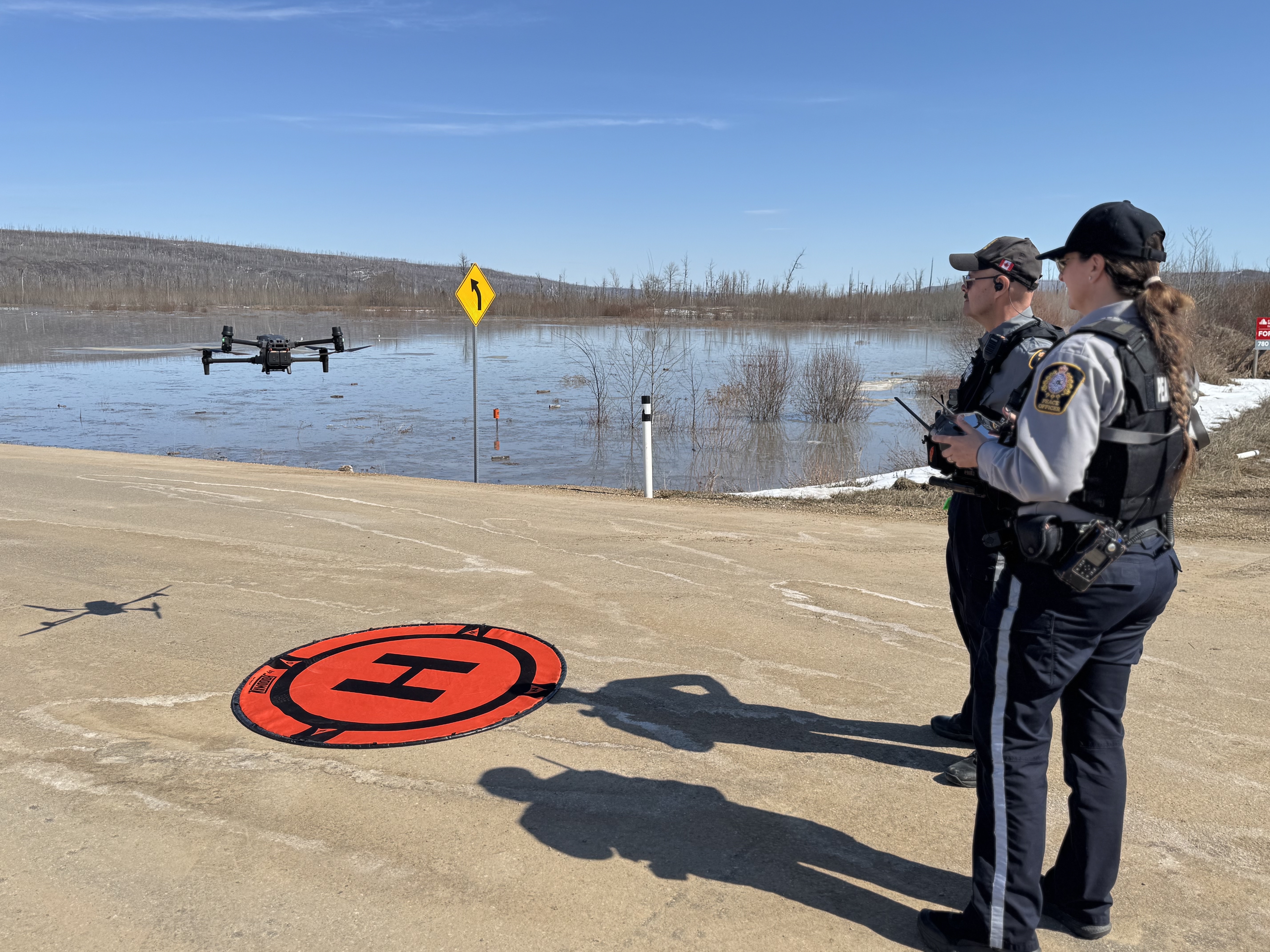 Bylaw Services officers fly a drone to observe riverbanks along the Clearwater River.