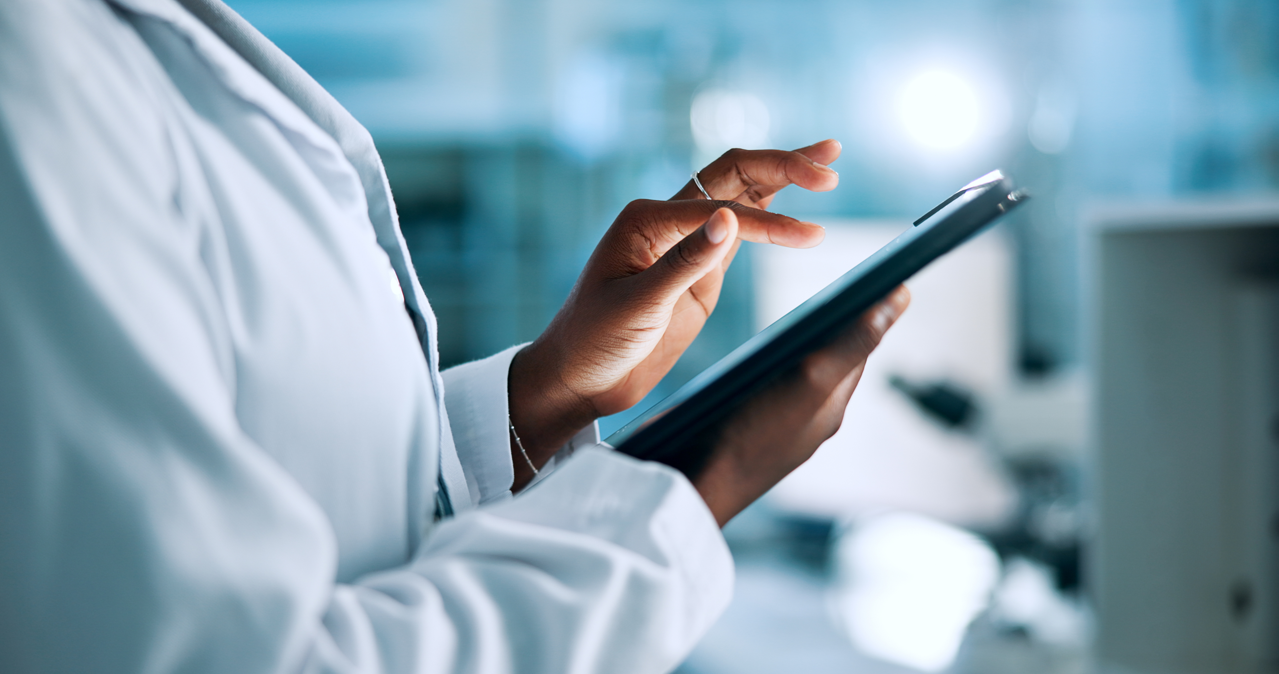 This is a photo of a person holding a tablet. 