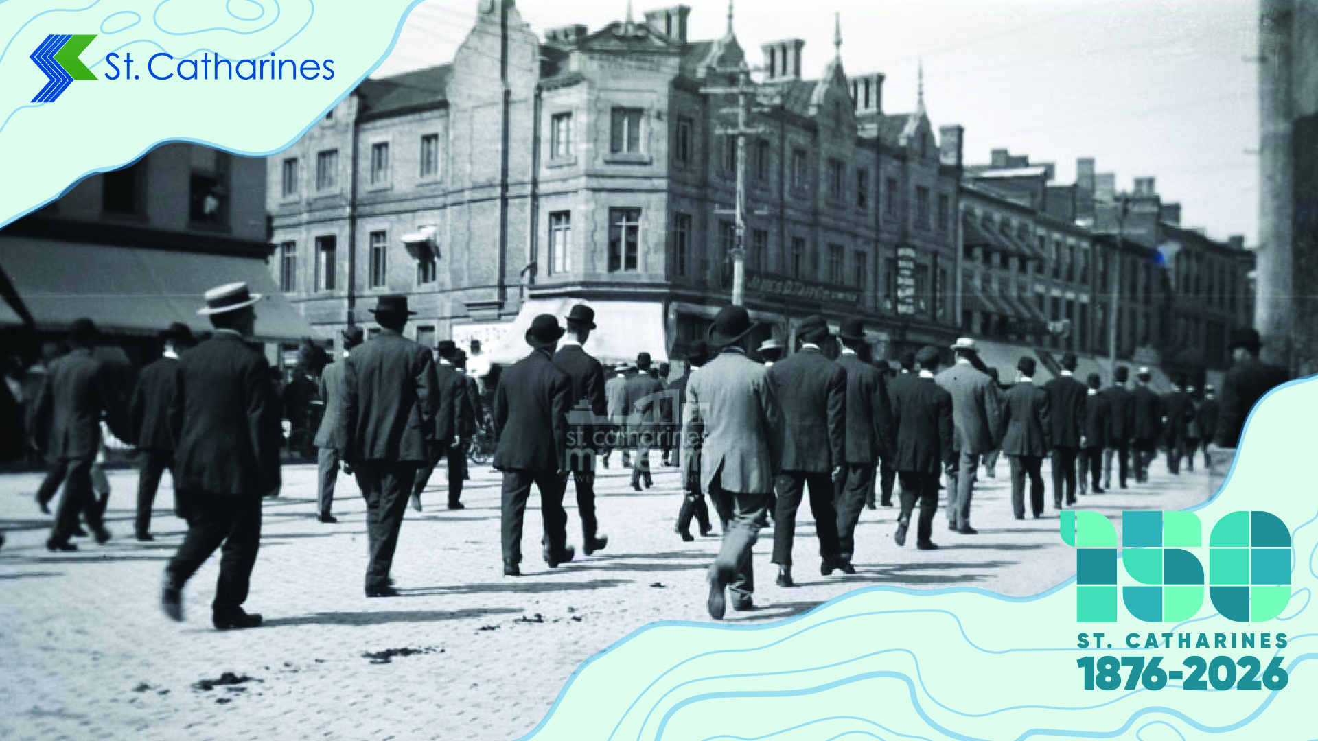 A parade on St. Paul Street crosses in front of the James D. Tait Co. department store.