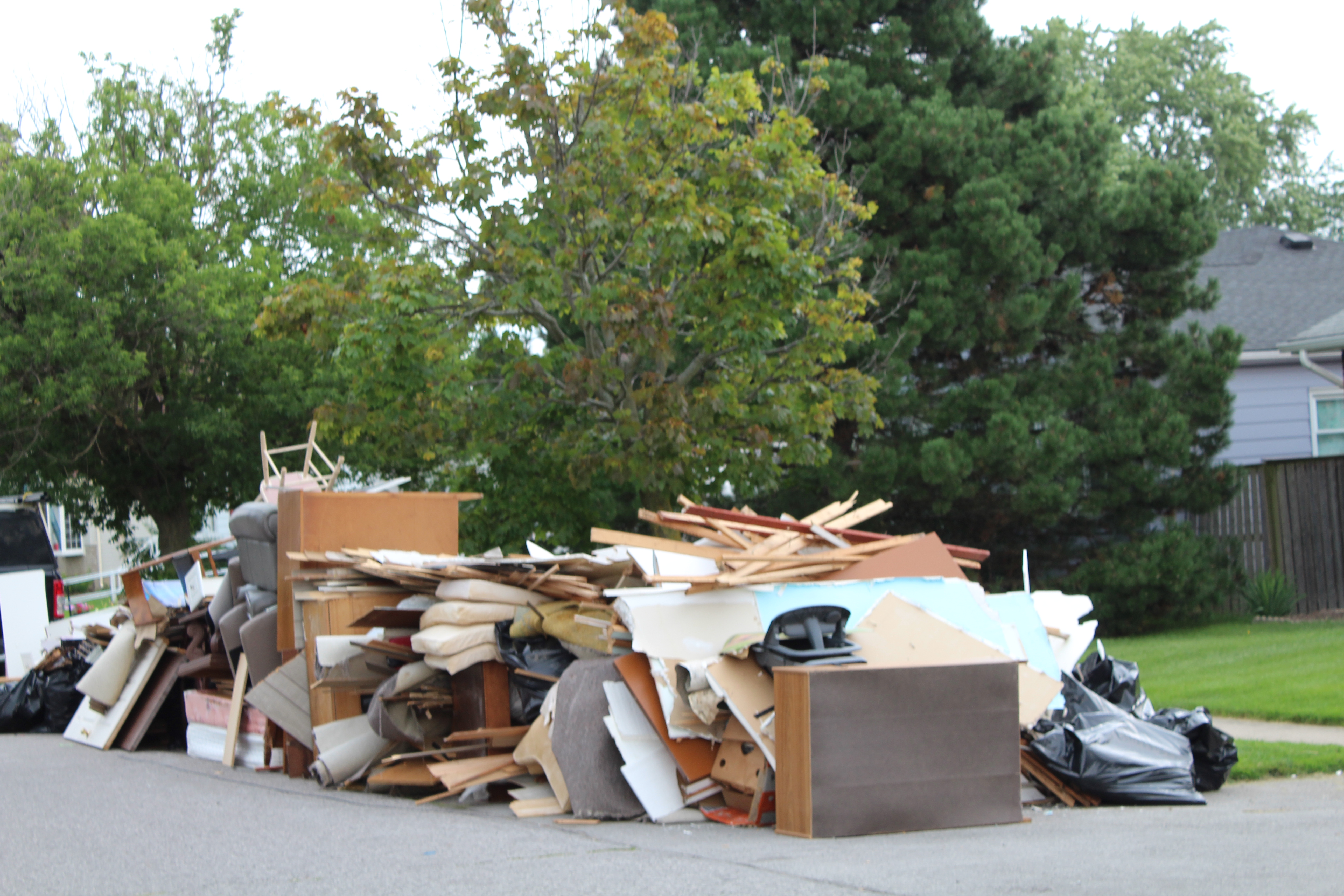 Flood waste piled at the curb in front of a home in St. Catharines.