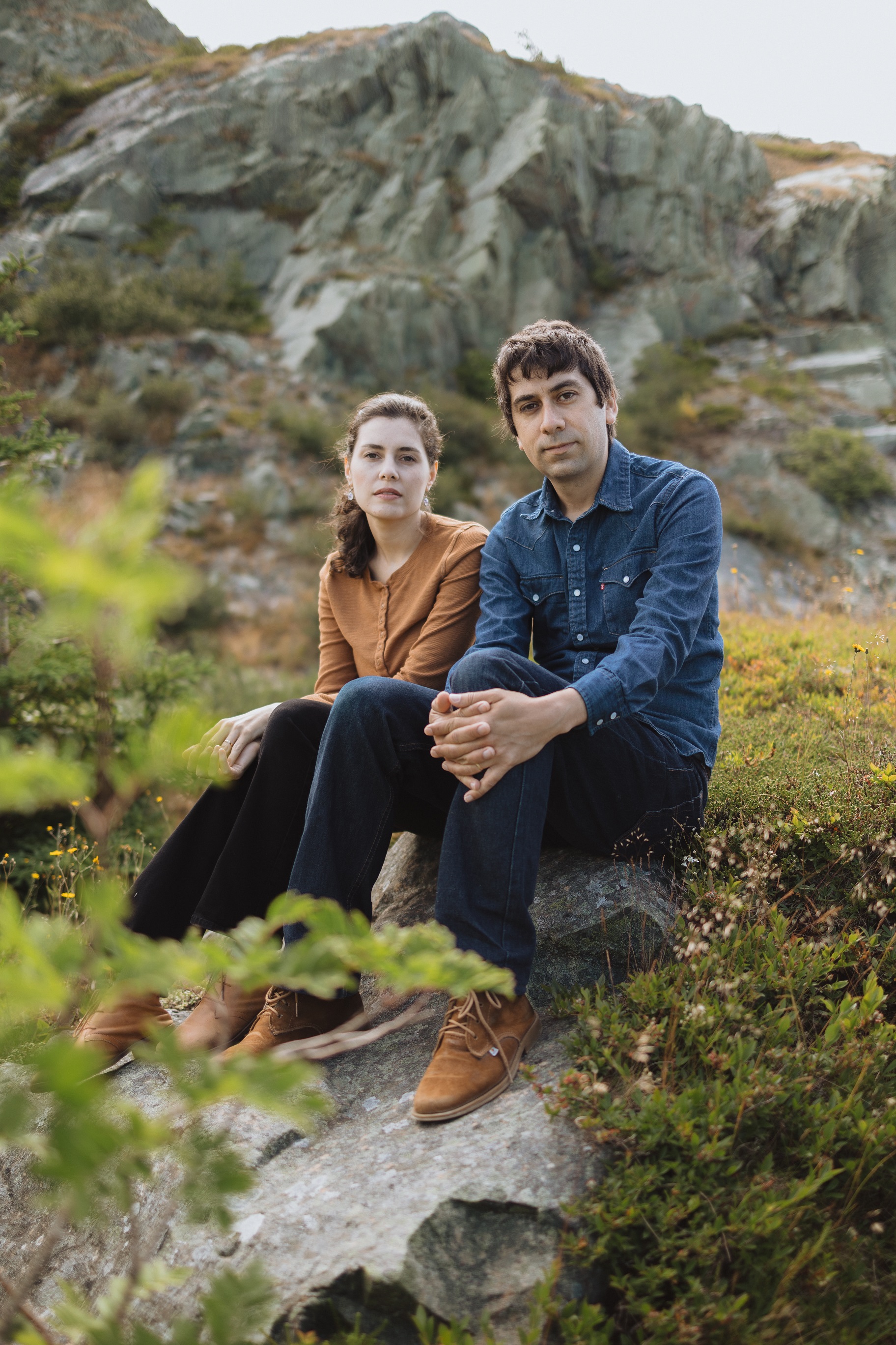 Image of Ana & Eric sitting on a hill