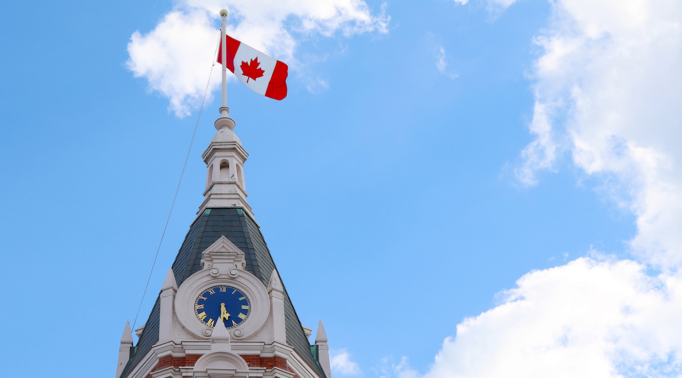 City Hall clock tower with Canadian flag on top