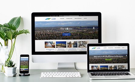 BWG website homepage on the screen of a monitor, smart phone and laptop