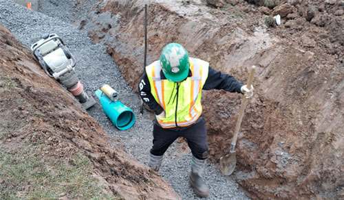 construction worker in a hole