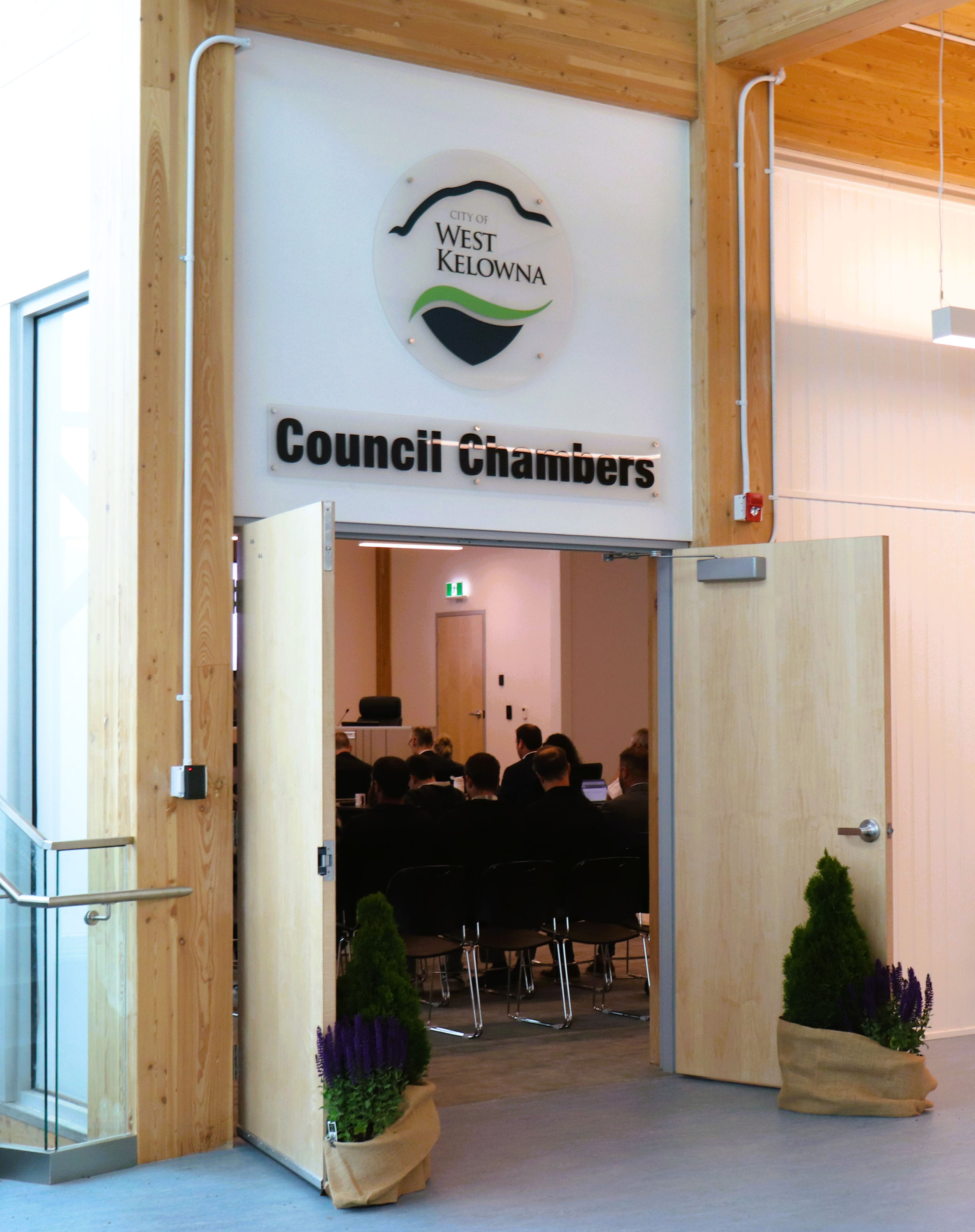 The large main wooden doors to West Kelowna Council Chambers.