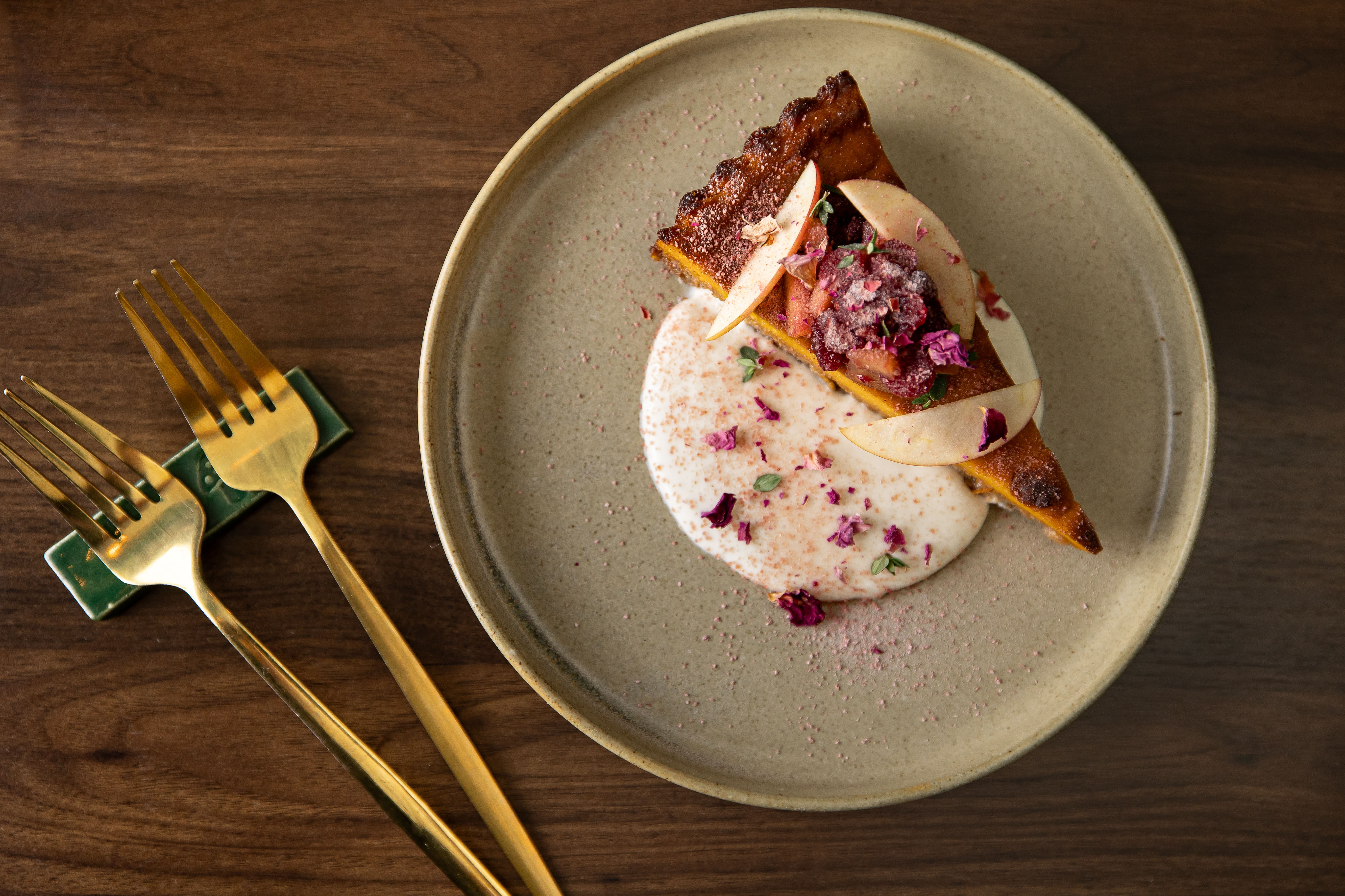 Sweet potato cheese cake with sauce on top 