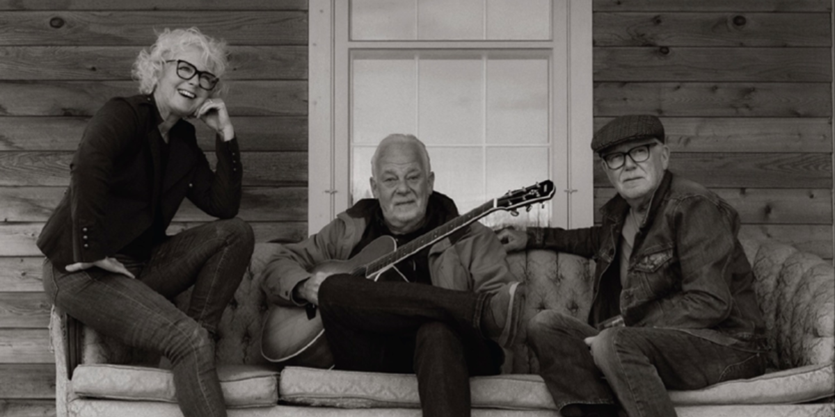 Musicians sitting on a sofa