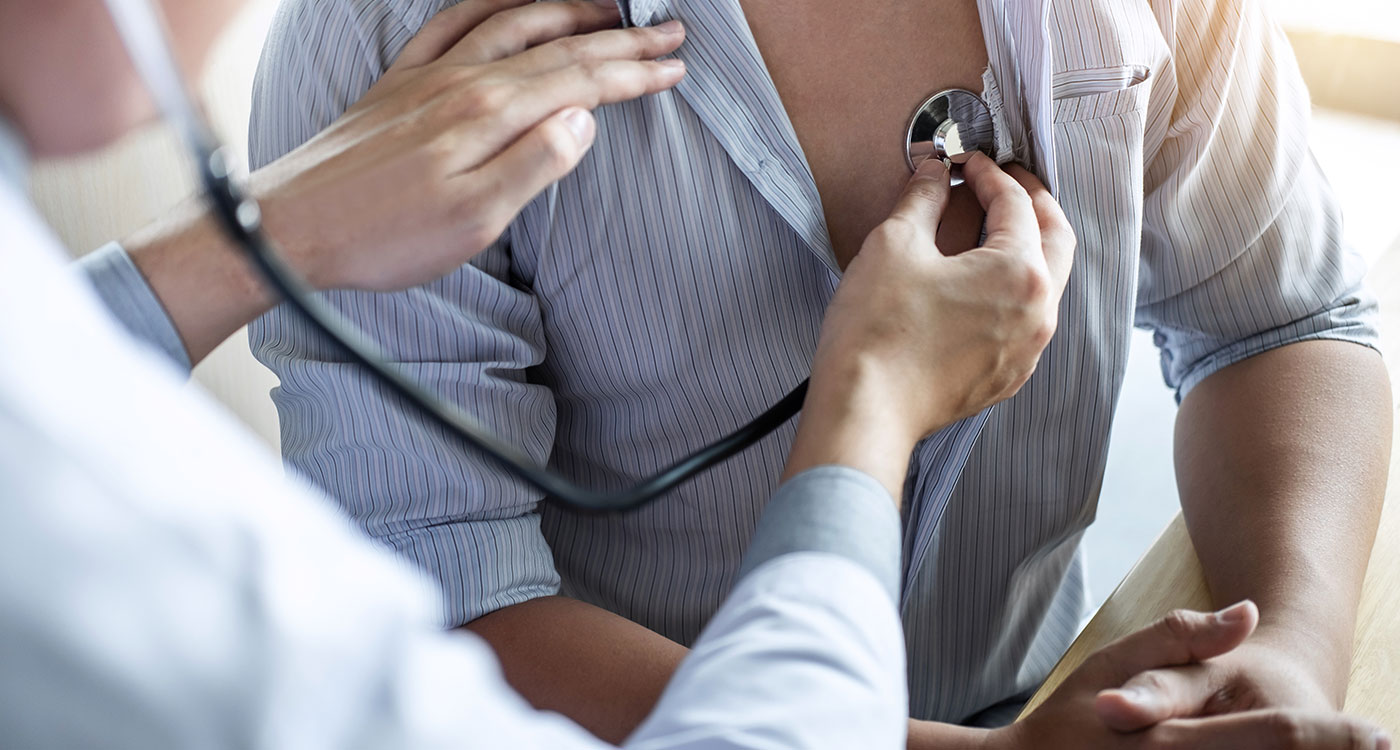 Doctor using a stethoscope on a patient's chest