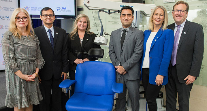 (l-r): Kiki Ferrari, Clinical Operations; Dr. Razi Sayeed, Psychiatry; Shelley Hofer, rTMS patient, Dr. Prakash Babani, Psychiatry; Mary Deacon, Chair, Bell Let’s Talk; and Ken Mayhew, Osler Foundation