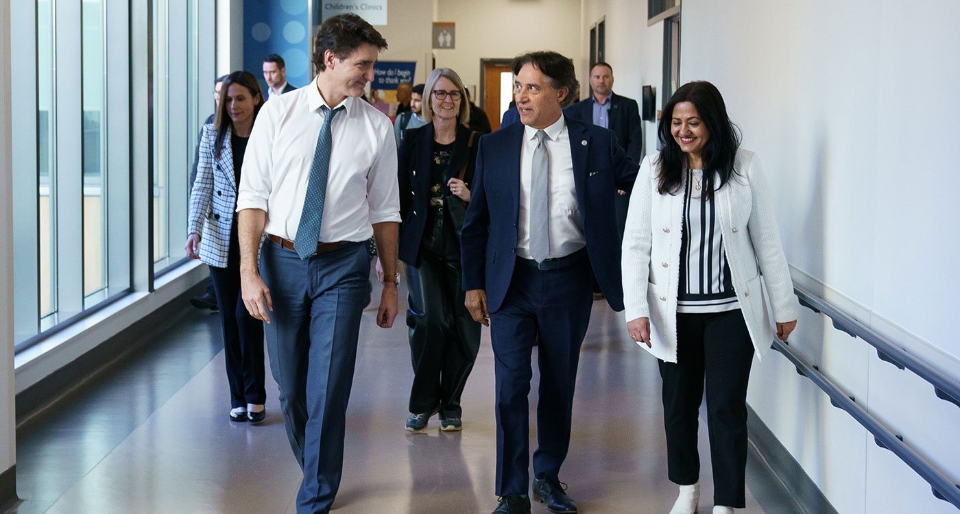 (l-r): Prime Minister Justin Trudeau walks the halls of Peel Memorial with Osler's President and CEO Dr. Frank Martino and MP Brampton South Sonia Sidhu