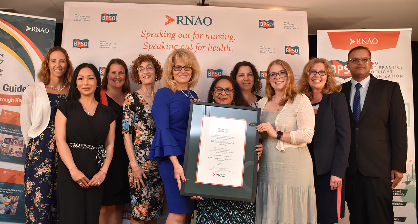 (l-r): Alysia Daley, Assistant Clinical Services Manager, Professional Practitioners; Rachelle DeLeon, Clinical Services Manager, Cardiology/Stroke/Medicine Program Assistants; Lara MacNeil, Clinical Services Manager, Transition Team; Mary Jane McNally, Chief Patient Experience Officer; Tiziana Rivera, Executive Vice President, Quality, Research & Chief Nursing Executive; Urmila Nandy, RPN EGH 10th level & Best Practice Champion; Carla Arpa, Clinical Nurse Educator, Respirology/General Medicine; Kim Johnston, Manager, Clinical Practice (BPSO lead); Patricia Geerlinks, Interim Associate Vice President, Practice & Academics; Bharat Paul, Quality Improvement Consultant, accepting Osler’s BPSO Designation at RNAO’s Annual General Meeting on Thursday, June 20
